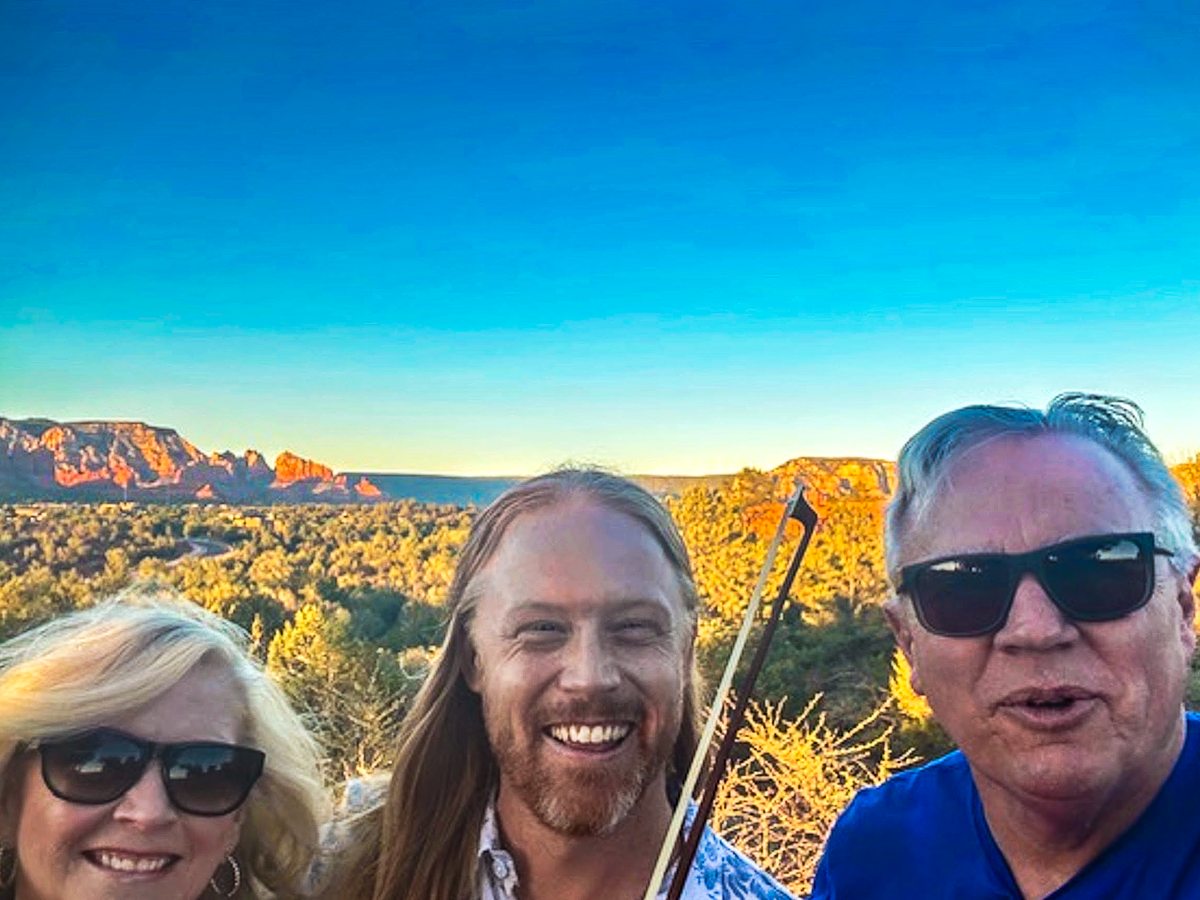 Couple sharing a moment during a private violin experience in Sedona
